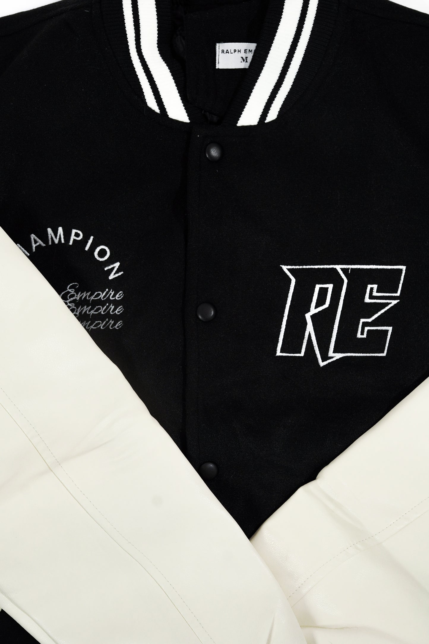 Empire Elite – Premium Collegejacke – Schwarz und Weiß.