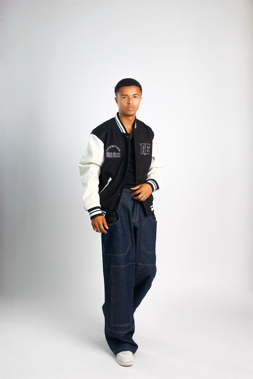 Empire Elite – Premium Collegejacke – Schwarz und Weiß. 